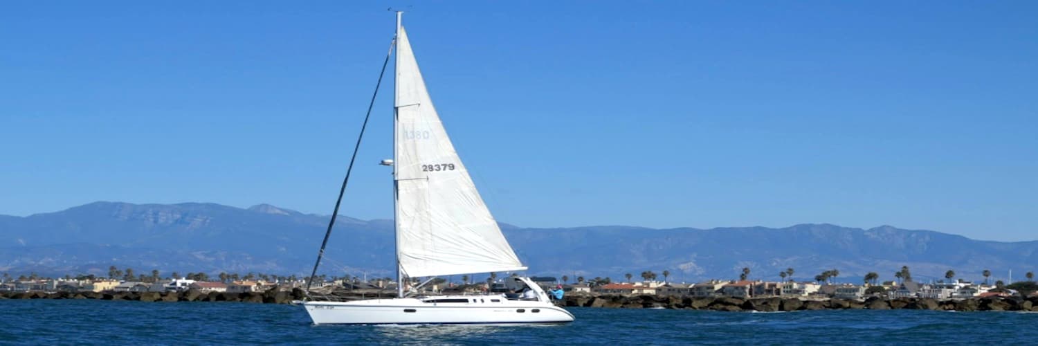 Fairwind sailboat under full sail off the coast